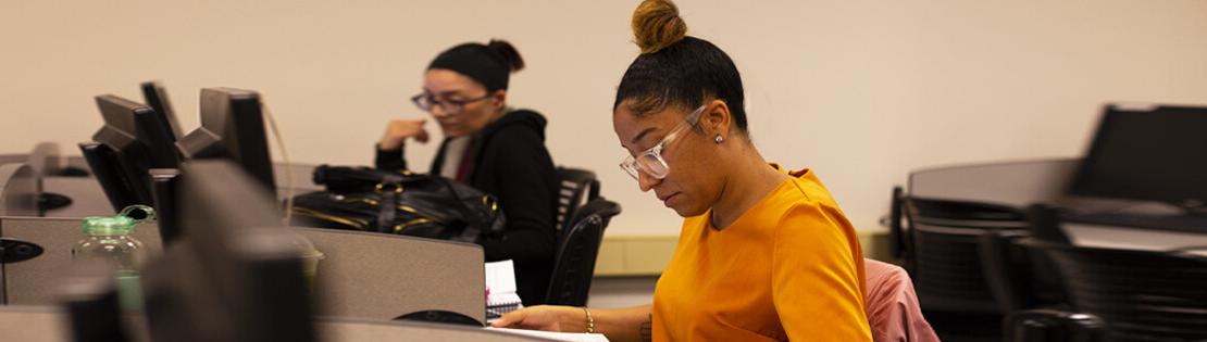 Two students study in a Pima classroom